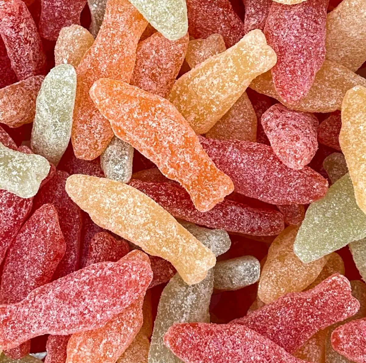 Sour Pastel Fish — Chewy fish-shaped candies in dreamy pastel colors with a zesty sour coating