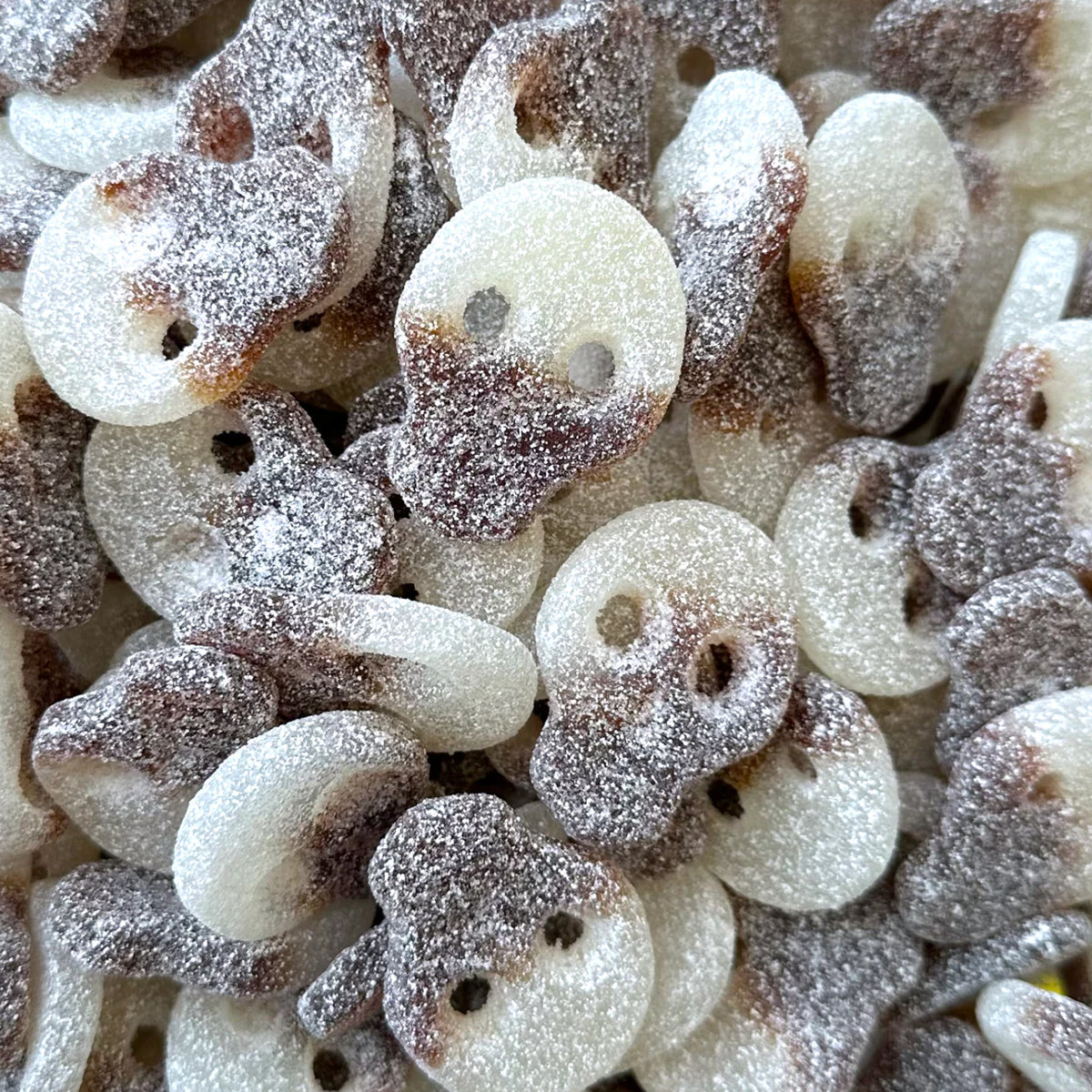 Fizzy Cola Skulls — Cola, but make it skull. Bouncy gummy with a fizzy crackle and a classic soda kick