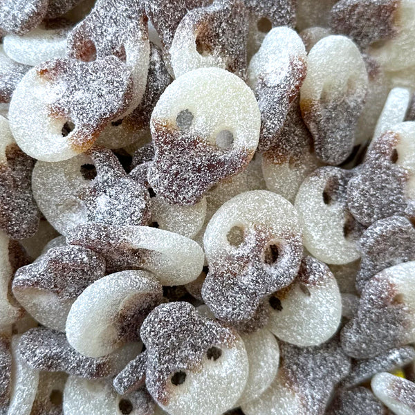 Fizzy Cola Skulls — Cola, but make it skull. Bouncy gummy with a fizzy crackle and a classic soda kick