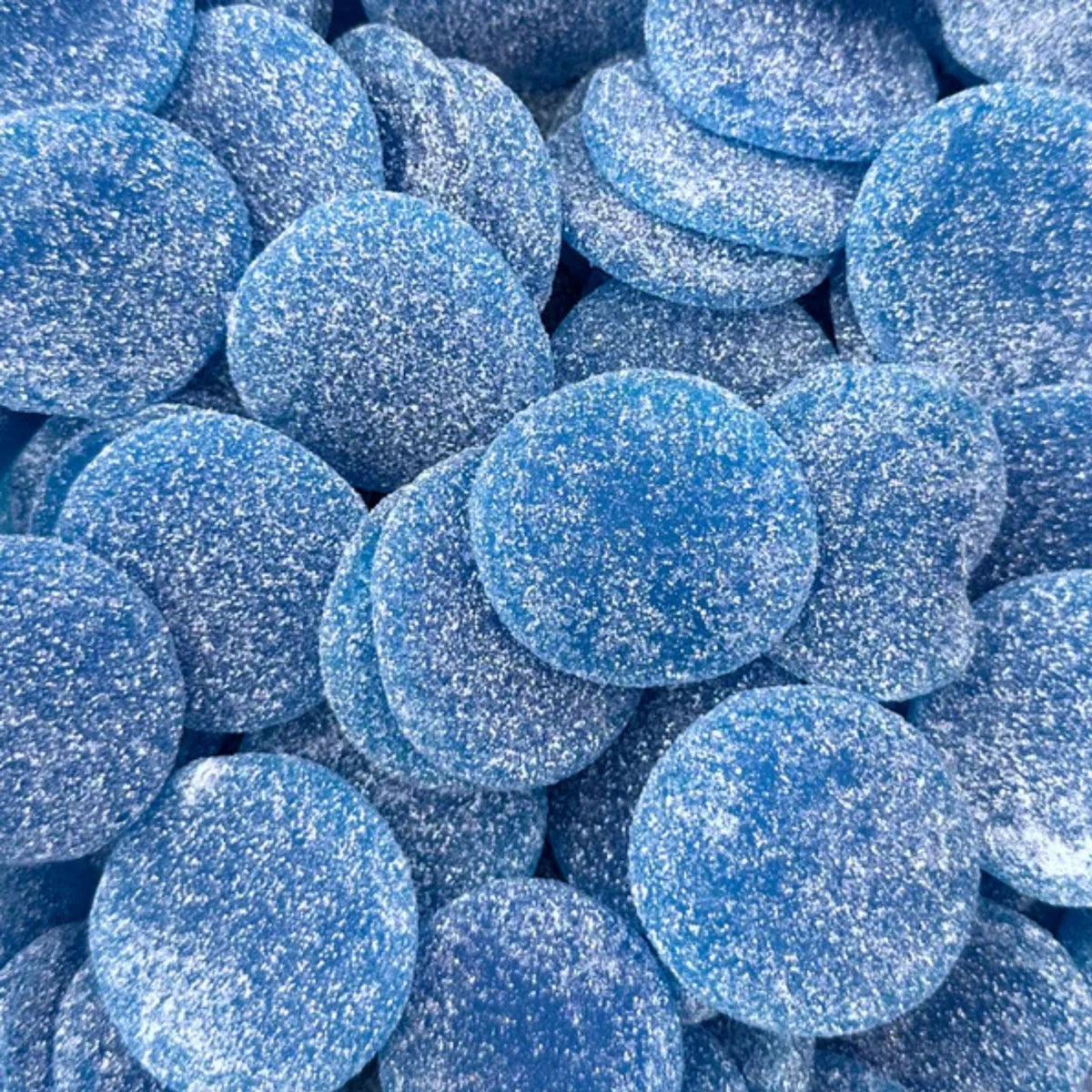 Sour Blue Smileys — Smiling outside, sour inside. Squishy blue gummies with a fizzy little sting