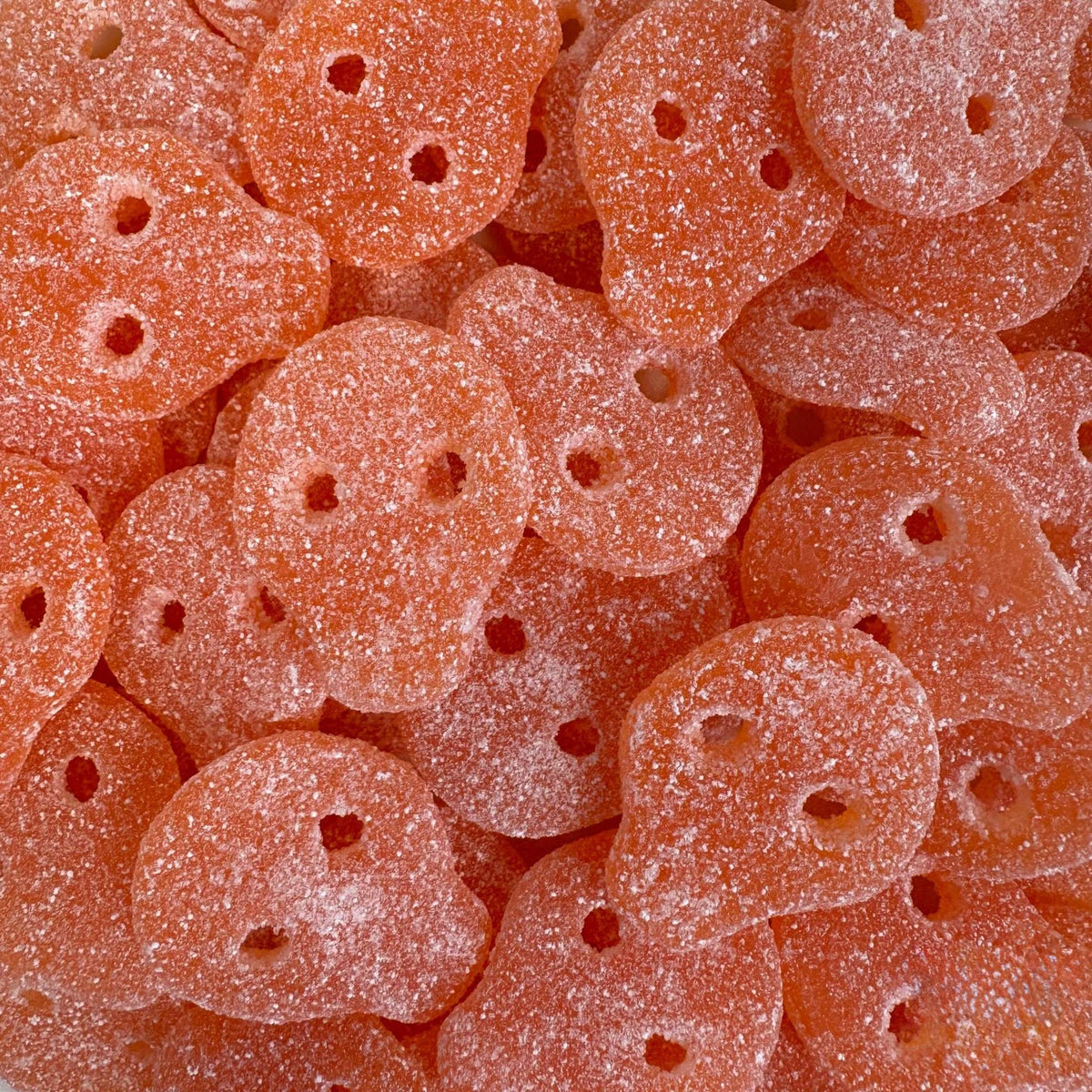 Sour Mango Skulls — Mango goes sour. Soft, chewy skulls with a tangy coating
