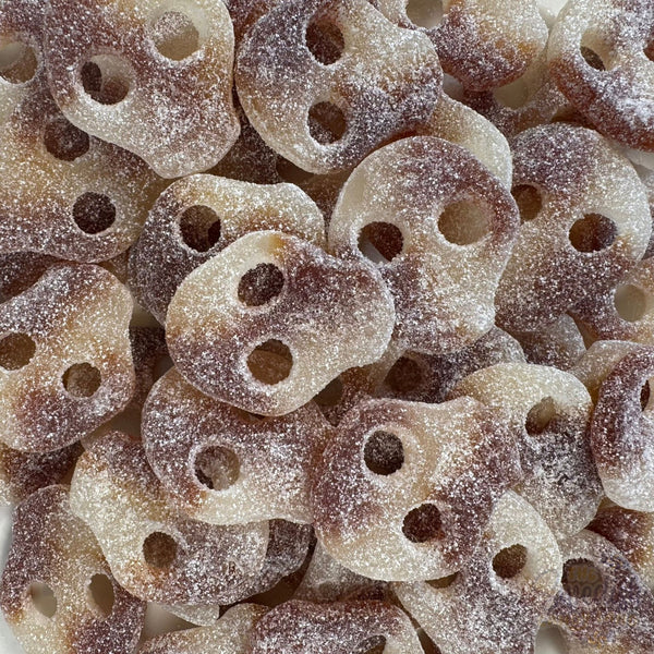 Sassy Cola Skulls — Fizz outside, cola inside. Bouncy chewy skulls with a popping-sugar crackle and a classic soda kick